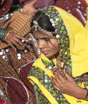 PUSHKAR, INDIA - NOVEMBER 21:  An unidentified girl in colorful ethnic attire attends at the Pushkar fair on November 21, 2012 in Pushkar, Rajasthan, India.