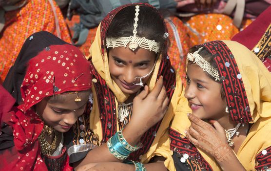 PUSHKAR, INDIA - NOVEMBER 21:  An unidentified girls in colorful ethnic attire attends at the Pushkar fair on November 21, 2012 in Pushkar, Rajasthan, India.