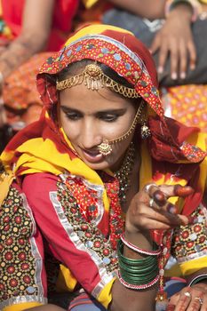 PUSHKAR, INDIA - NOVEMBER 21:  An unidentified girl in colorful ethnic attire attends at the Pushkar fair on November 21, 2012 in Pushkar, Rajasthan, India.