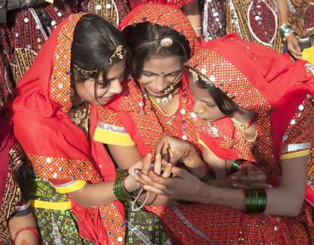 PUSHKAR, INDIA - NOVEMBER 21:  An unidentified girls in colorful ethnic attire attends at the Pushkar fair on November 21, 2012 in Pushkar, Rajasthan, India.