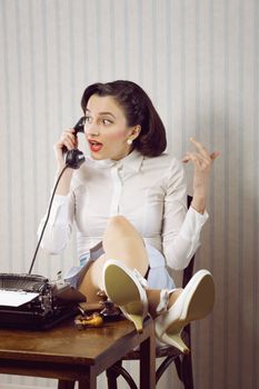 Gossip news, business woman talking on phone at desk