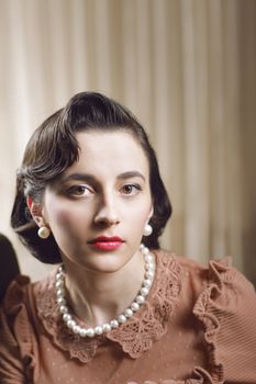 Beautiful woman at home, 1950 styled 