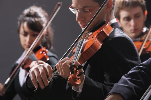 Symphony music, violinist at concert, hand close up