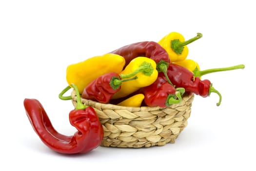 red and yellow peppers in a basket