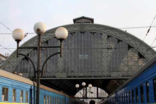 trains on platform of railway station in Lviv