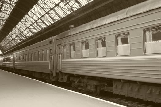 train on railway station in sepia