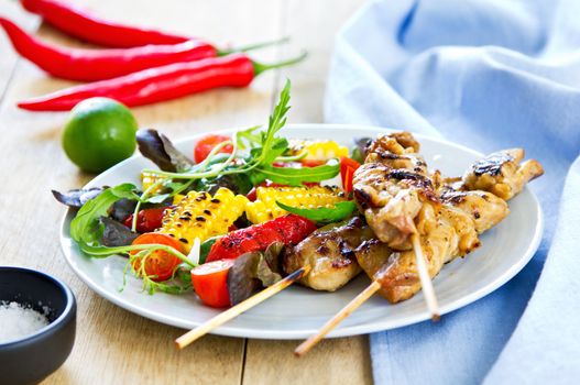 Grilled chicken skewer with grilled vegetables salad