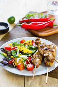 Grilled chicken skewer with grilled vegetables salad