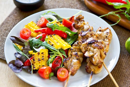 Grilled chicken skewer with grilled vegetables salad