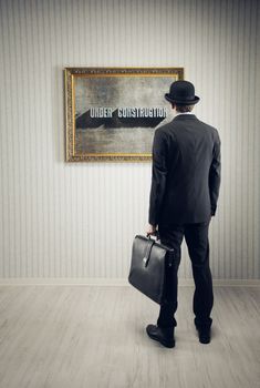 Man observes a picture at the museum