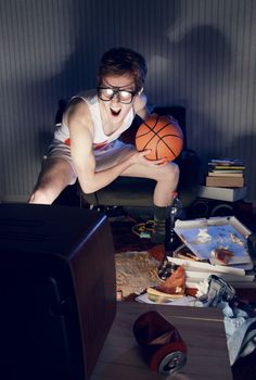 Nerdy excited basketball fans watching television