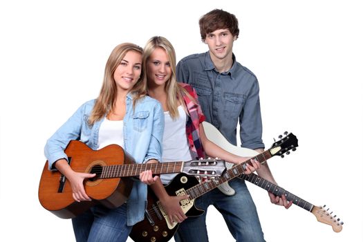 Three teenage guitar players
