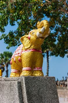 Thai stone elephant on a pedestal on a sunny day in Thailand