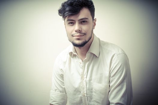 young modern stylish man on vignetting background