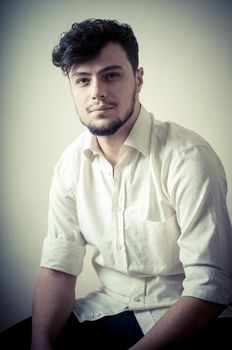 young modern stylish man on vignetting background