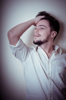 young modern stylish man on vignetting background