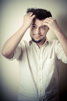 young modern stylish man on vignetting background