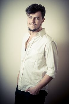 young modern stylish man on vignetting background