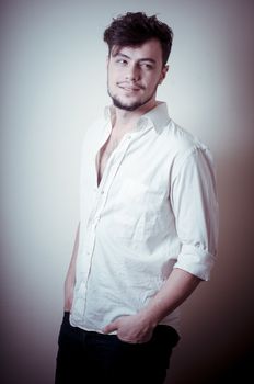 young modern stylish man on vignetting background
