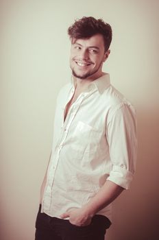young modern stylish man on vignetting background