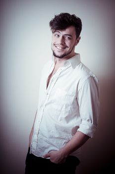 young modern stylish man on vignetting background