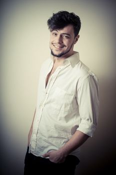 young modern stylish man on vignetting background