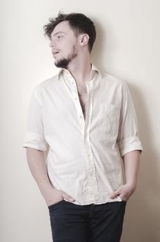 young modern stylish man on vignetting background