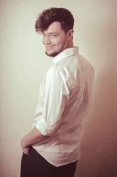young modern stylish man on vignetting background