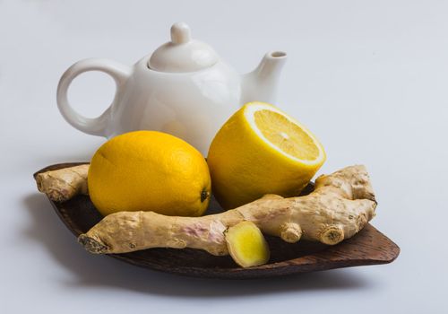 Ginger and lemon isolated on white background