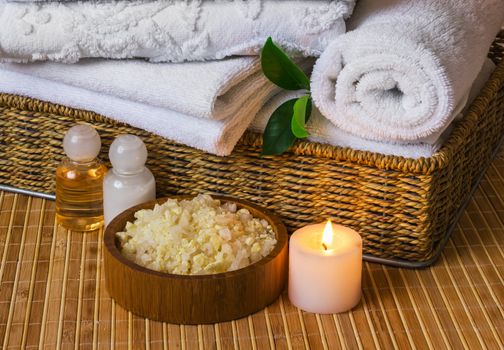 Spa with towels with a candle and other accessories