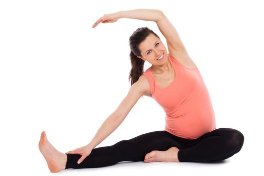 Beautiful pregnant woman working out isolated over white background