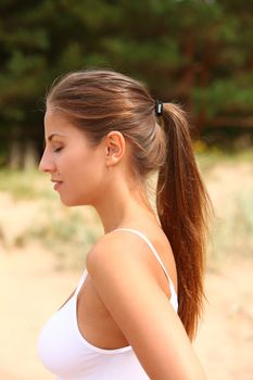 Beautiful caucasian woman enjoys summer sunny outdoors