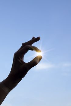 Hand holding sun