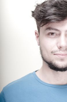portrait of stylish young man with blue shirt on vignetting background