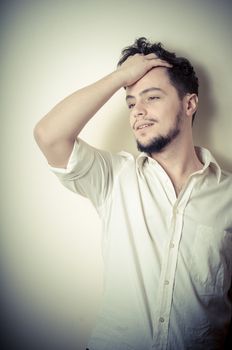 young modern stylish man on vignetting background