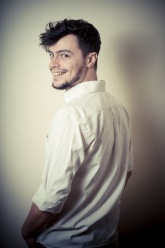 young modern stylish man on vignetting background