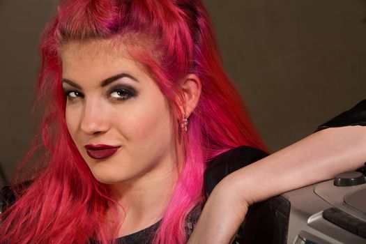 Cute young European woman with pink hair