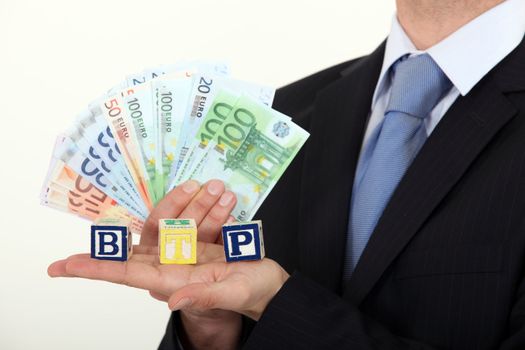businessman holding bank notes