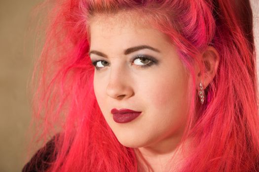 Close up of pretty punk girl in pink hair