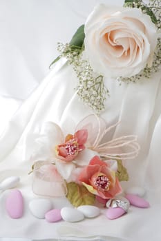 Wedding favors,wedding rings and flowers on white background