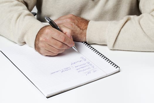 Mid section image of a businessman writing.