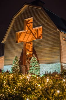architectural cross at a village decorated for christmas time