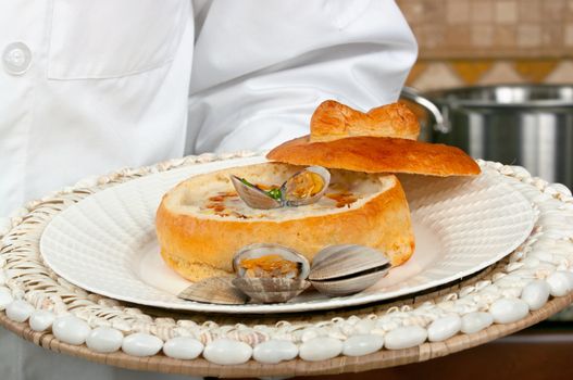 Clam chowder soup in a sour dough bread bowl