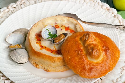 Clam chowder soup in a sour dough bread bowl