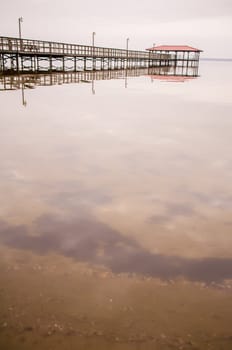 pier in calm water on a lake