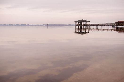 pier in calm water on a lake