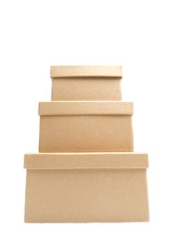 Three square paper boxes on white background, one on top of another