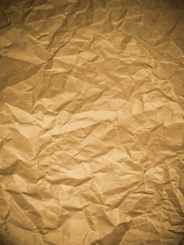 Yellow wrinkled paper as a background