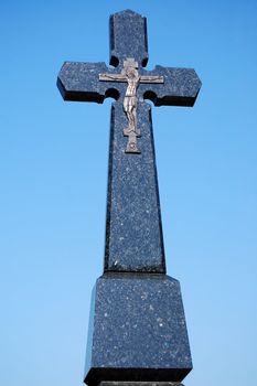 stone cross wirh Jesus image