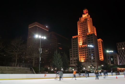 providence on a cold december evening with people ice skating